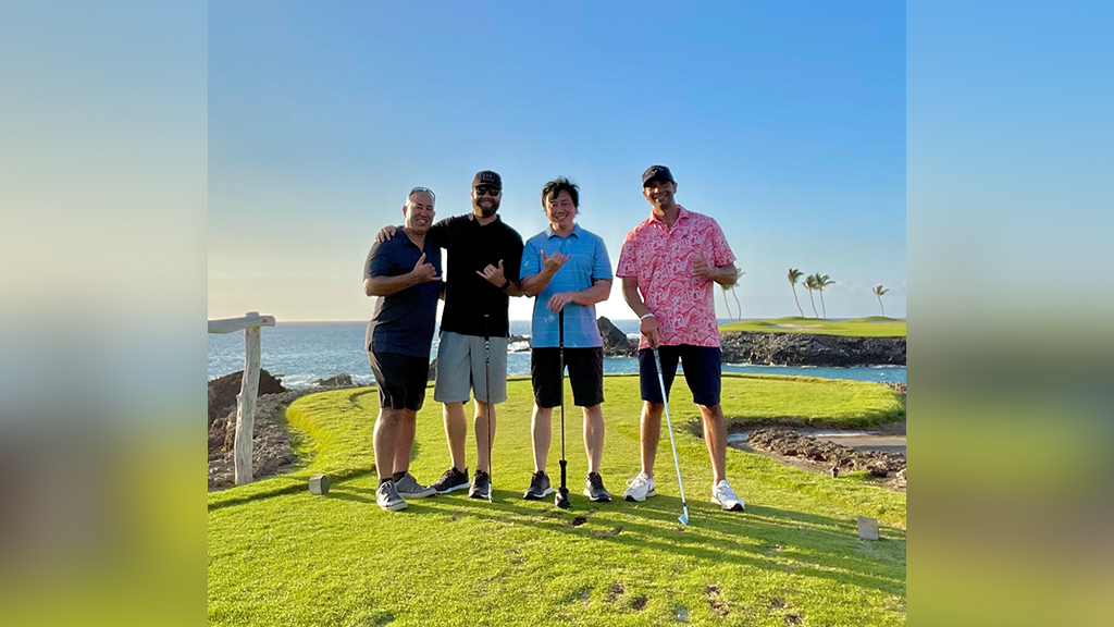 Ian Parrish (2nd from left) golfing with clients at Mauna Lani Golf Course