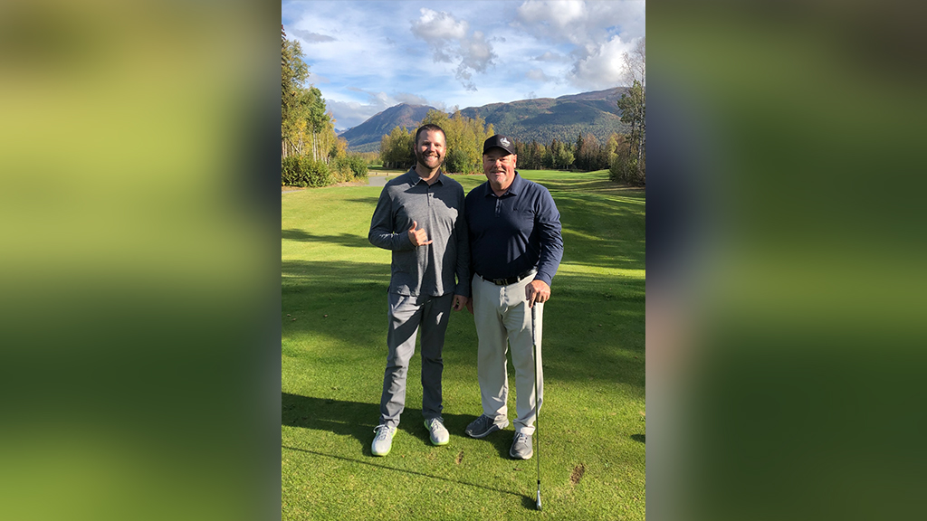 Ian Parrish (BSBA '12, MBA '14), pictured left, at Moose Run Golf Course in Alaska with its golf professional