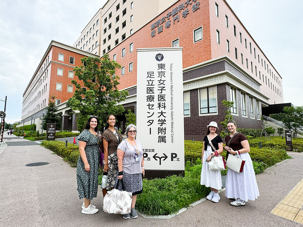 (Left to right) Brooke Rathe, Halo Yoshiki, Jo Wakayama, Mia Takahashi, Ashley Wright in front of the Tokyo Women's Medical University Adachi Medical Center where much of the university's clinical practices are held