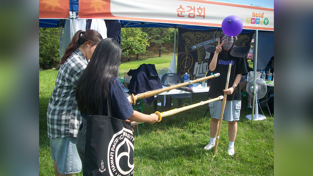 Soonchunyang students participate in Club Day, a two-day event introducing students to different school clubs; Reycajen sporting her HPU bag learns about the Kendo club