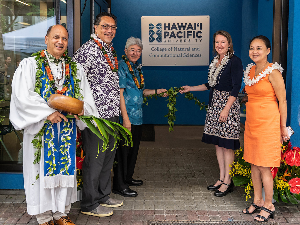 HPU leadership members Lance Wilhelm, John Gotanda, and Brenda Jensen (left to right) join Christine Camp (far right) and Kahu Kordell Kekoa (far left) for the maile lei untying ceremony