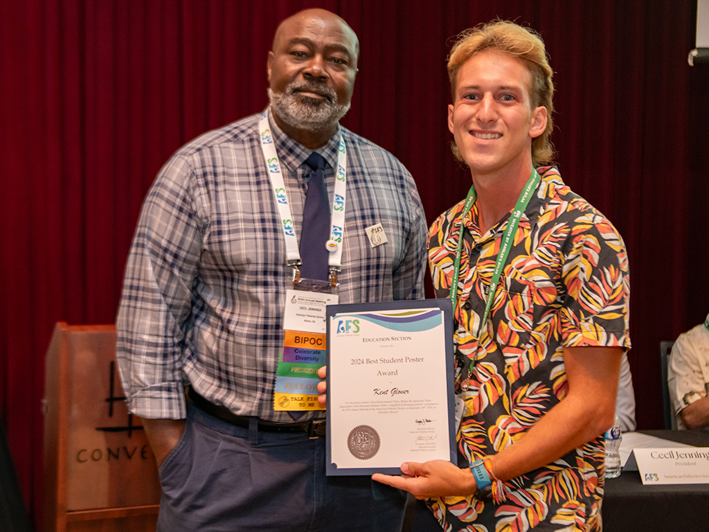 Kent Glover presents his project titled 'How Environmental Policy Shapes the Aquarium Trade: Aquaculture of the Hawaiian Endemic Potter's Angelfish (Centropyge potteri)'