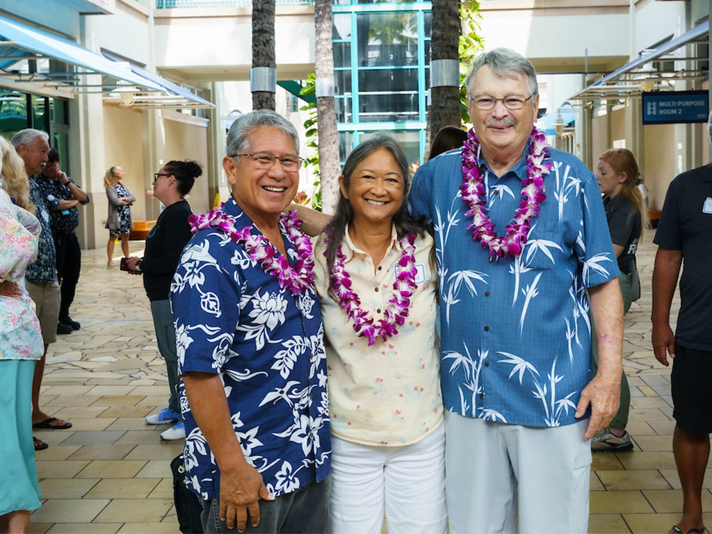 Kahu Hanai Danny Akaka Jr. and Anna Akaka, who kicked off the symposium with a traditional Hawaiian blessing, and George Balazs, workshop organizing committee lead