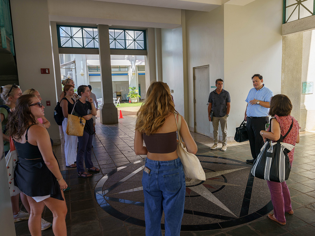 Doug Askman (center, in blue) at Aloha Tower with HPU students from his 'History of Hawai'i' course