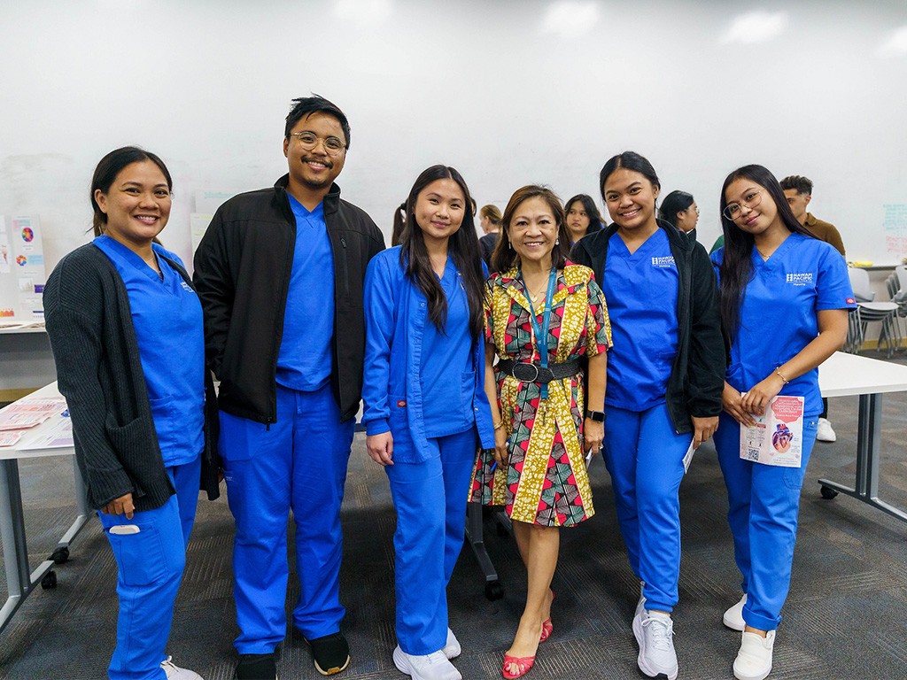 HPU Dean of the School of Nursing Edna Magpantay-Monroe with HPU nursing students