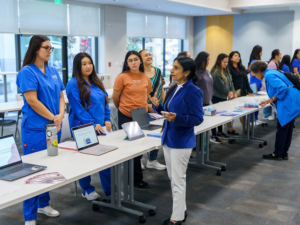 HPU Associate Professor Hazel Downing (right, in blue) led the event