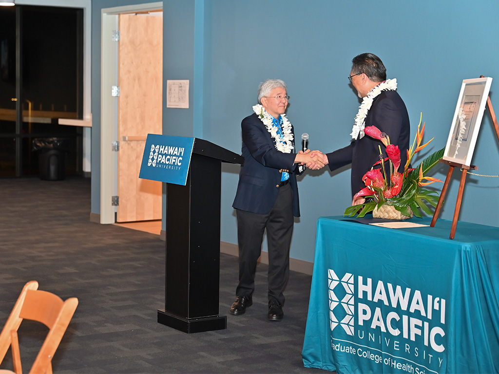 HPU President John Gotanda (left) and HPU Board Chair Lance Wilhelm (right) spoke at the event