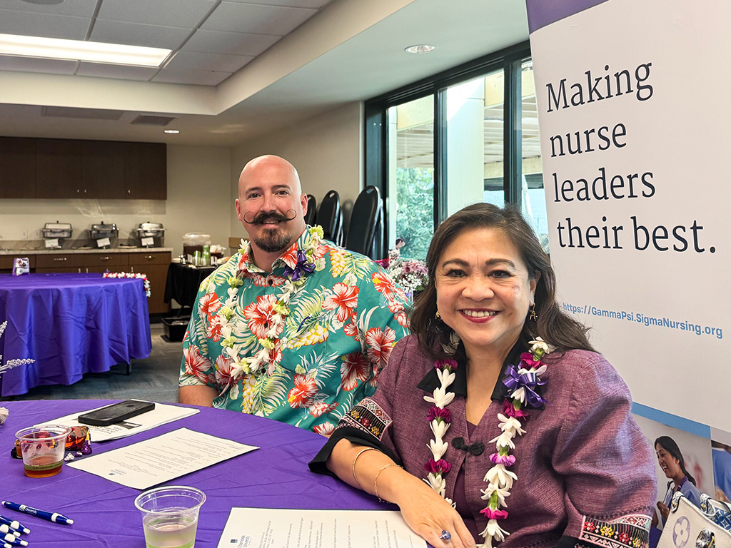 Derek Cegelka (left) and Dean Edna Magpantay-Monroe at the 2025 Sigma Education Day conference