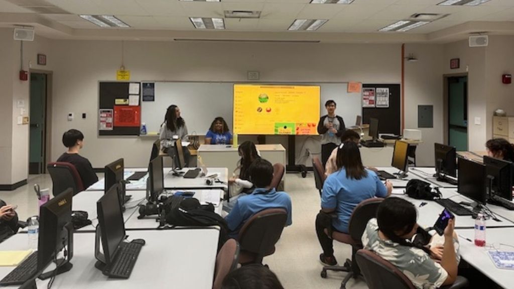 Assistant Directors of Student Engagement Tian Robinson (left) and Dyson Chee (right) and student Foxy Ramos present at a conference session